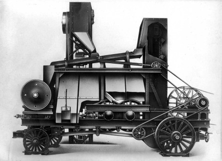 1920: One of the first wheeled, mobile crushing plants comprising a jaw crusher and roller stand, with elevations and flat belt drive.
