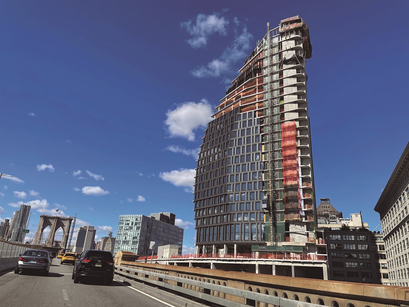 Convex Mixed‐Use Building Rises Next to The Brooklyn Bridge