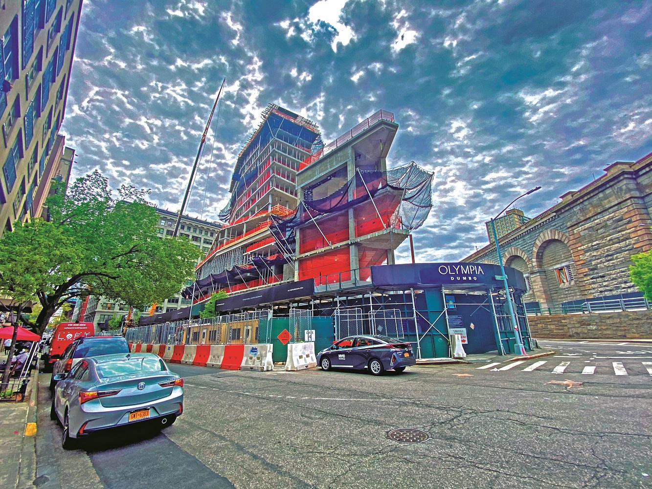 Convex Mixed‐Use Building Rises Next to The Brooklyn Bridge
