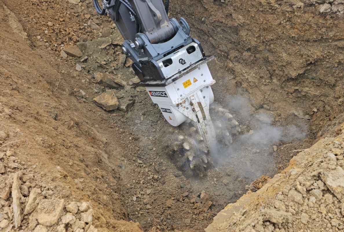 The rotary drum cutter attachment in action. Mounted on the large excavator, this attachment cut a large proportion of the solid dolomite rock.