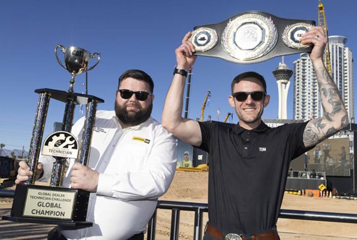 Tom March (right) from England won the inaugural Caterpillar Global Dealer Technician Challenge.
