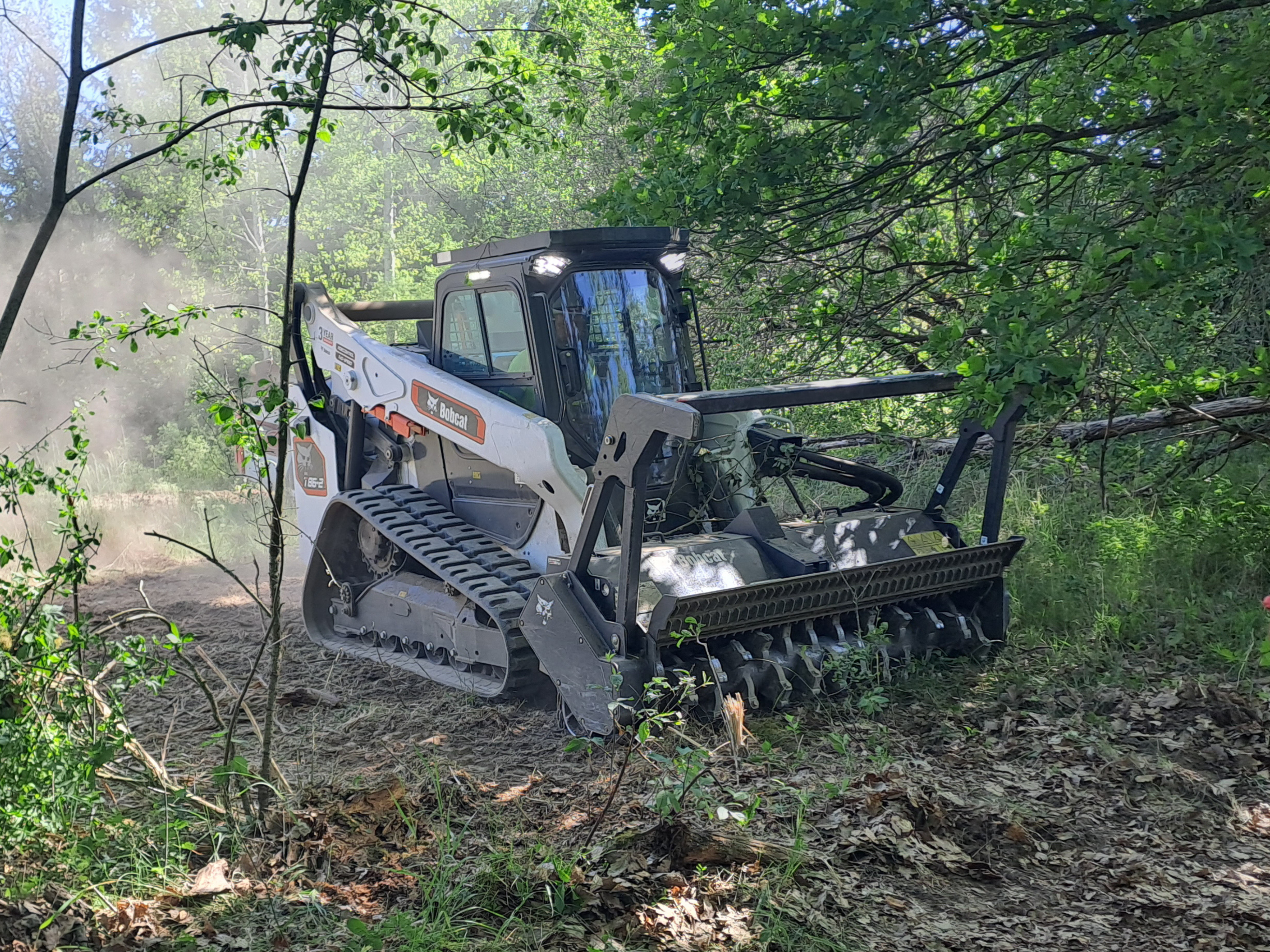 T86-2 track loader equipped with a forestry cutter