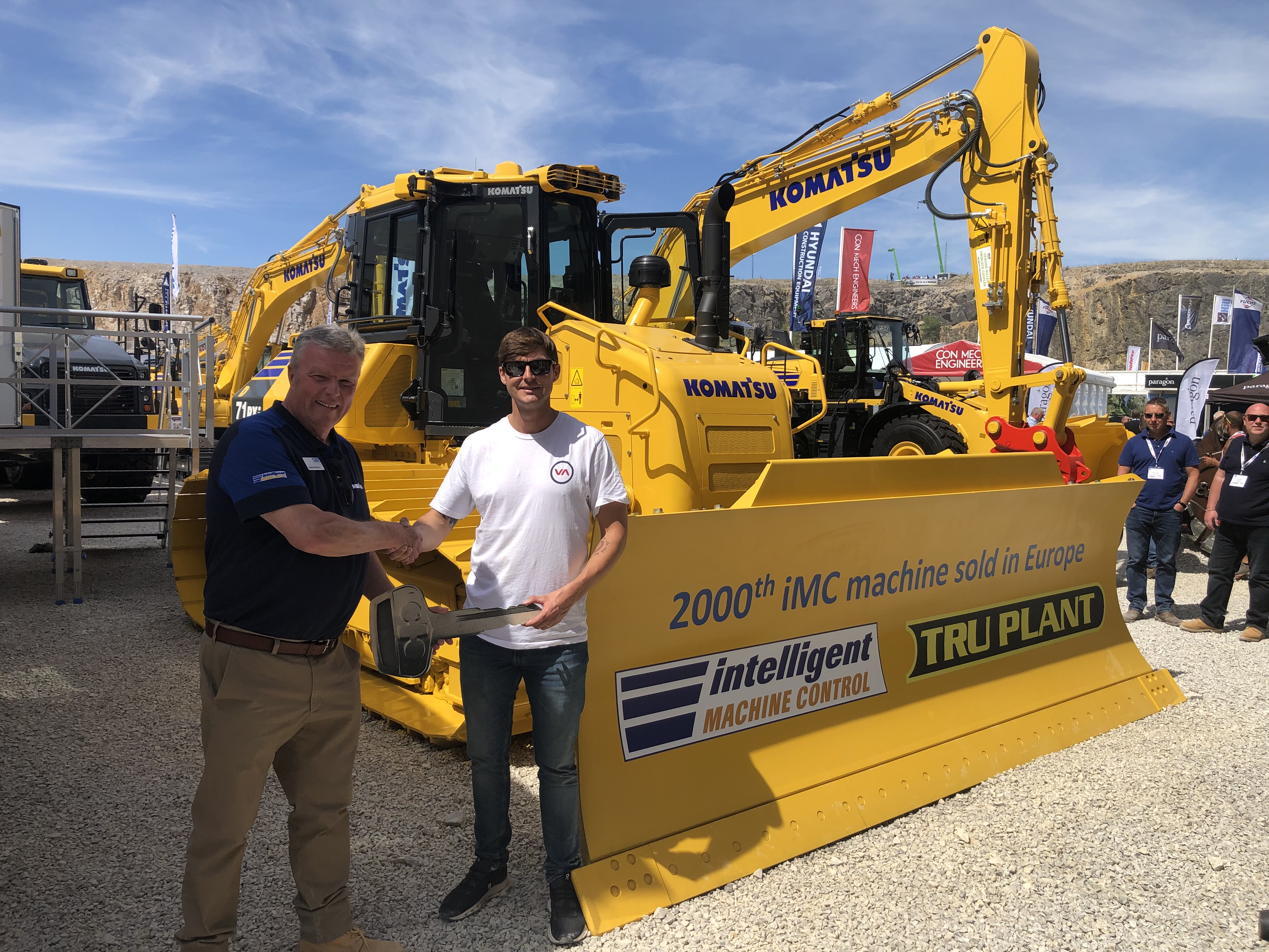 MKL Salesman, Eamonn Delaney handing over the machine to Jake Nicholls of TRU Plant.