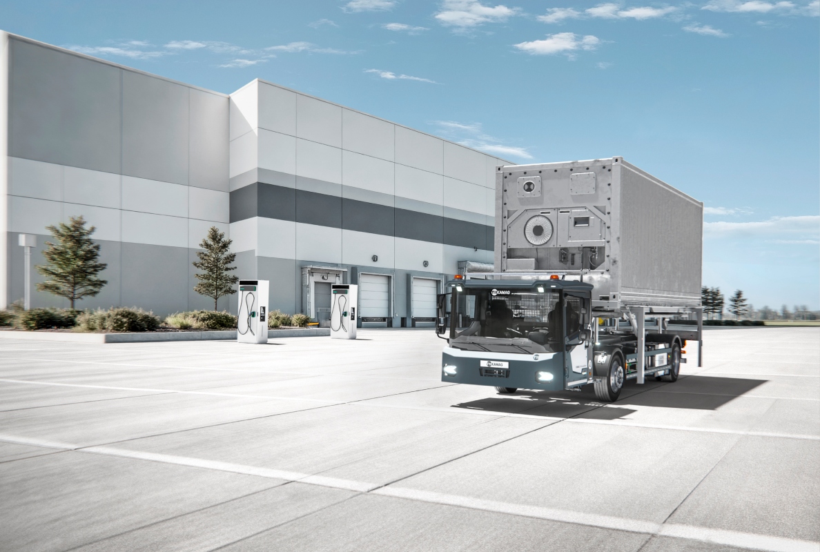 Visualization of the KAMAG ePM 101 with newly designed cab in operation on a logistics yard.
