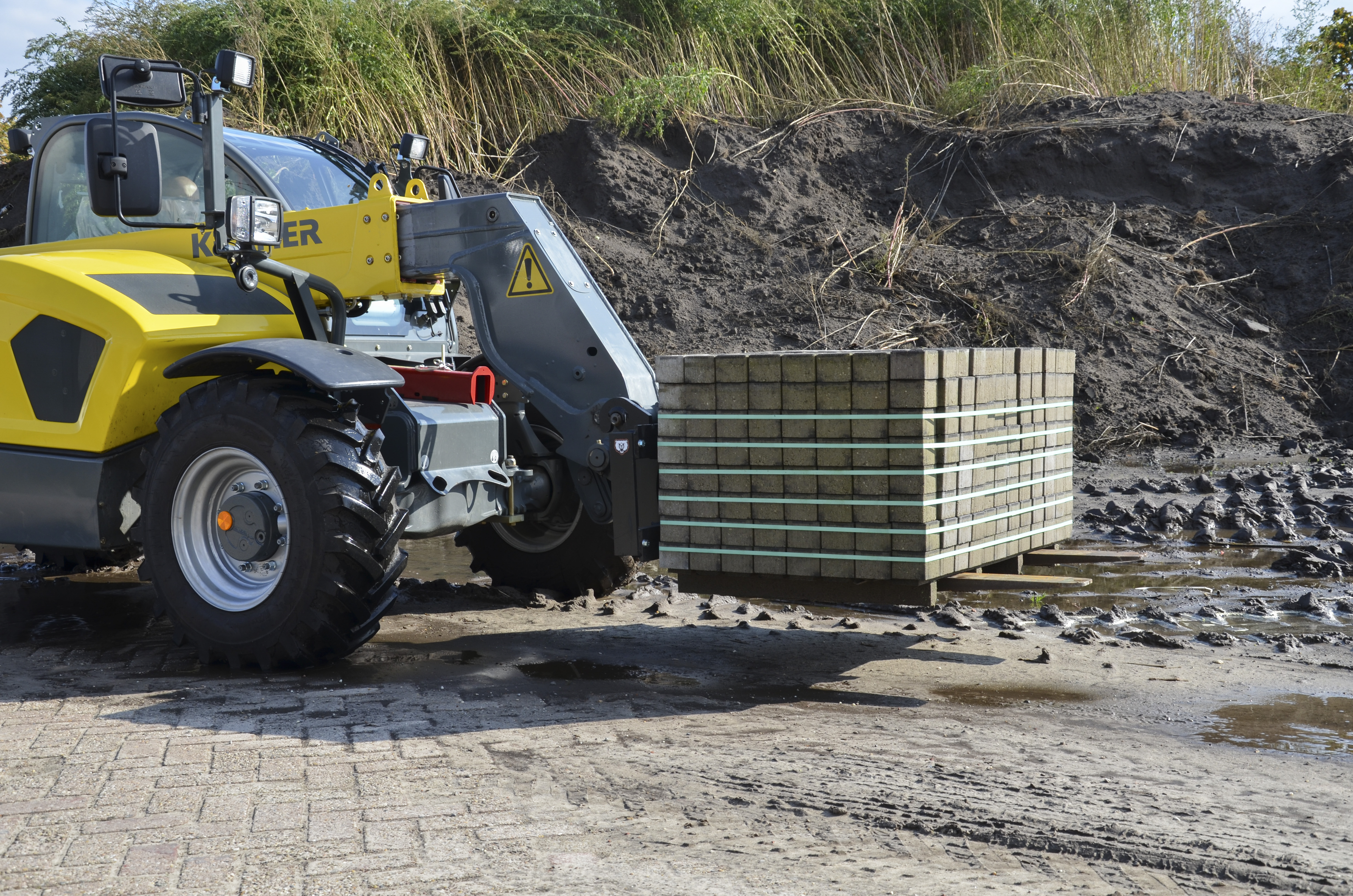 Telescopic handler with pallet fork from BEAR Attachments
