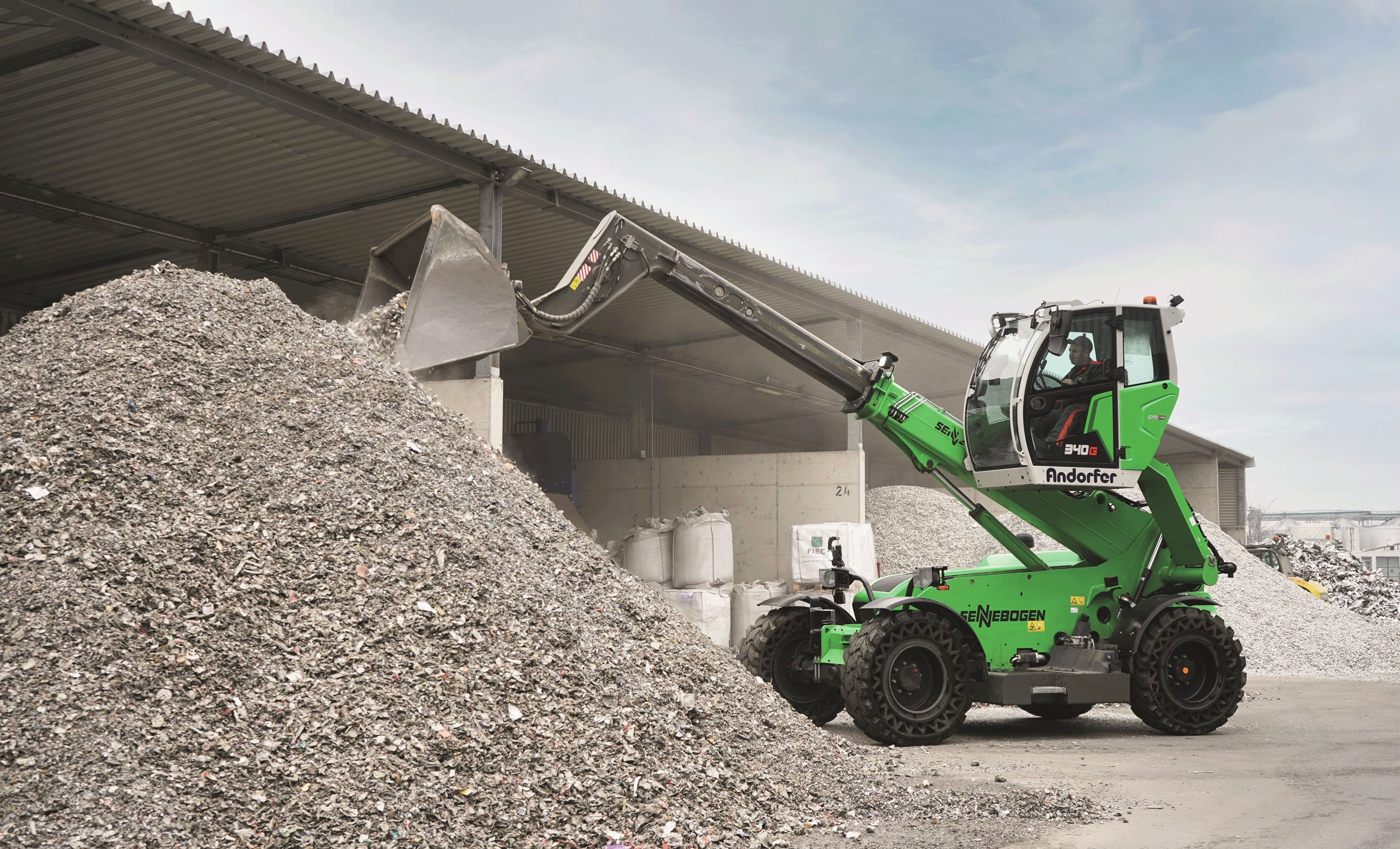 Extendable telescopic arm feeds filling tunnels effortlessly.