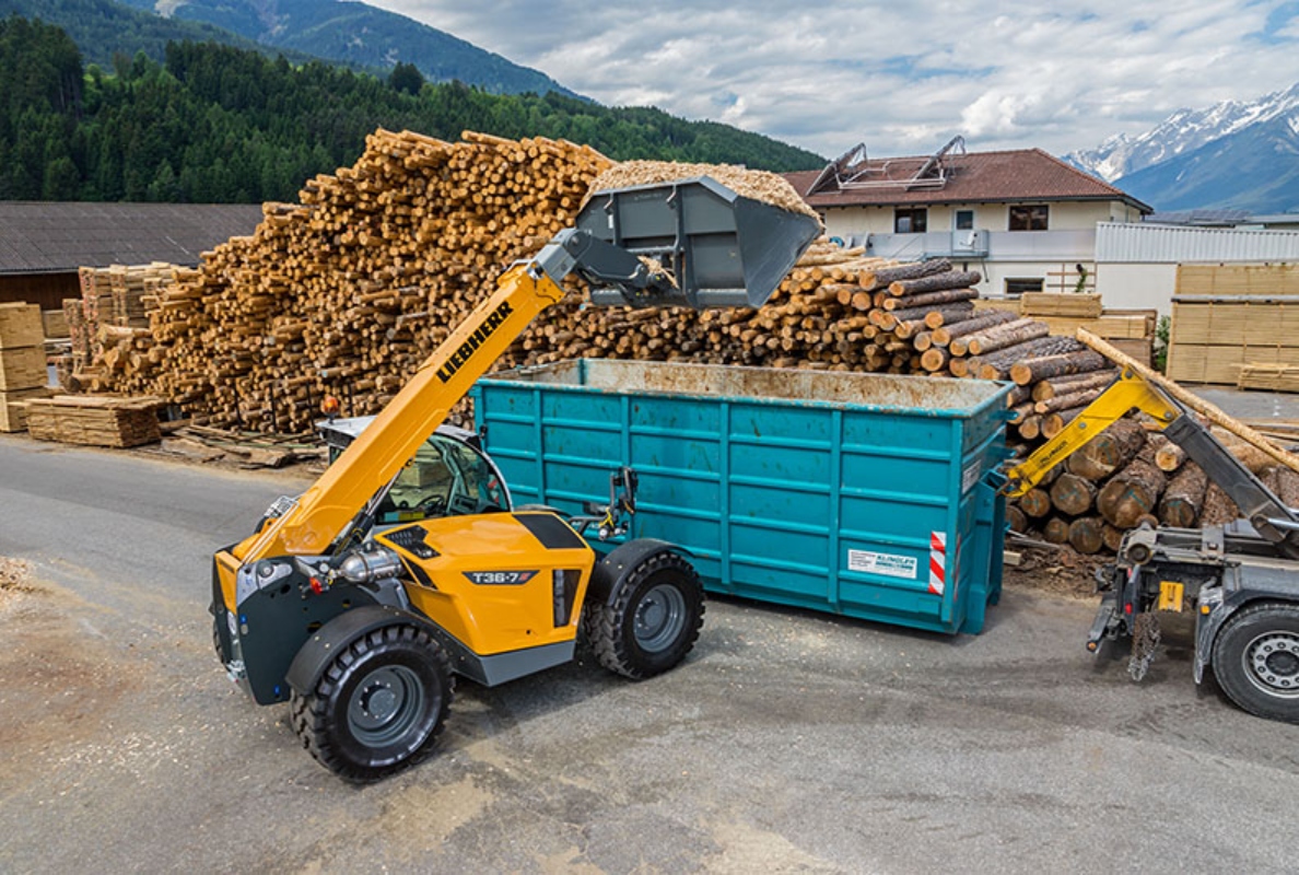 The Liebherr T-36-7s loads wood chips into a container.