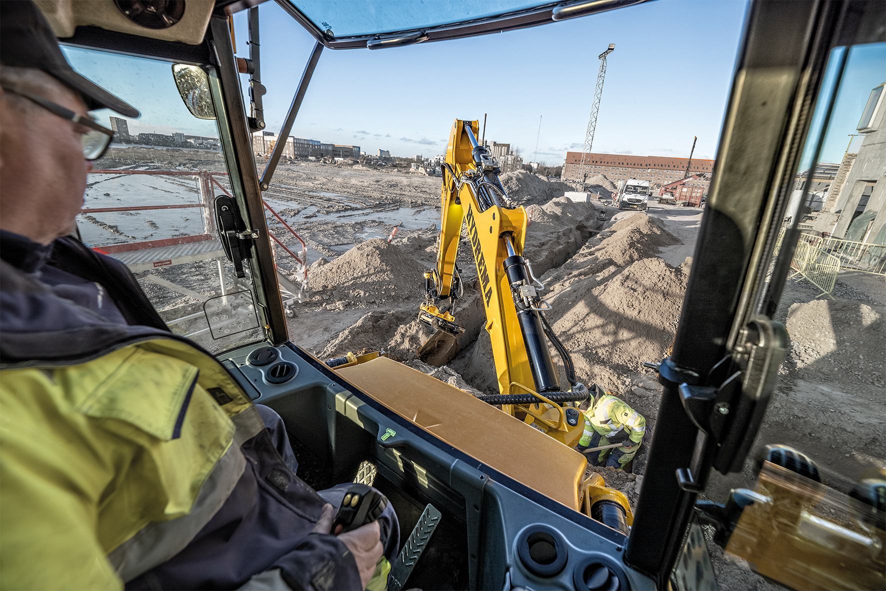 With a new interior design, multi-adjustable armrests and more adjustment options of the joystick functions, the new series of backhoe loaders offers several user-friendly updates. <br> Image source: Hydrema Group