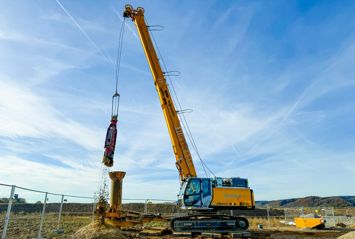 The grab is then attached to excavate the soil material.
