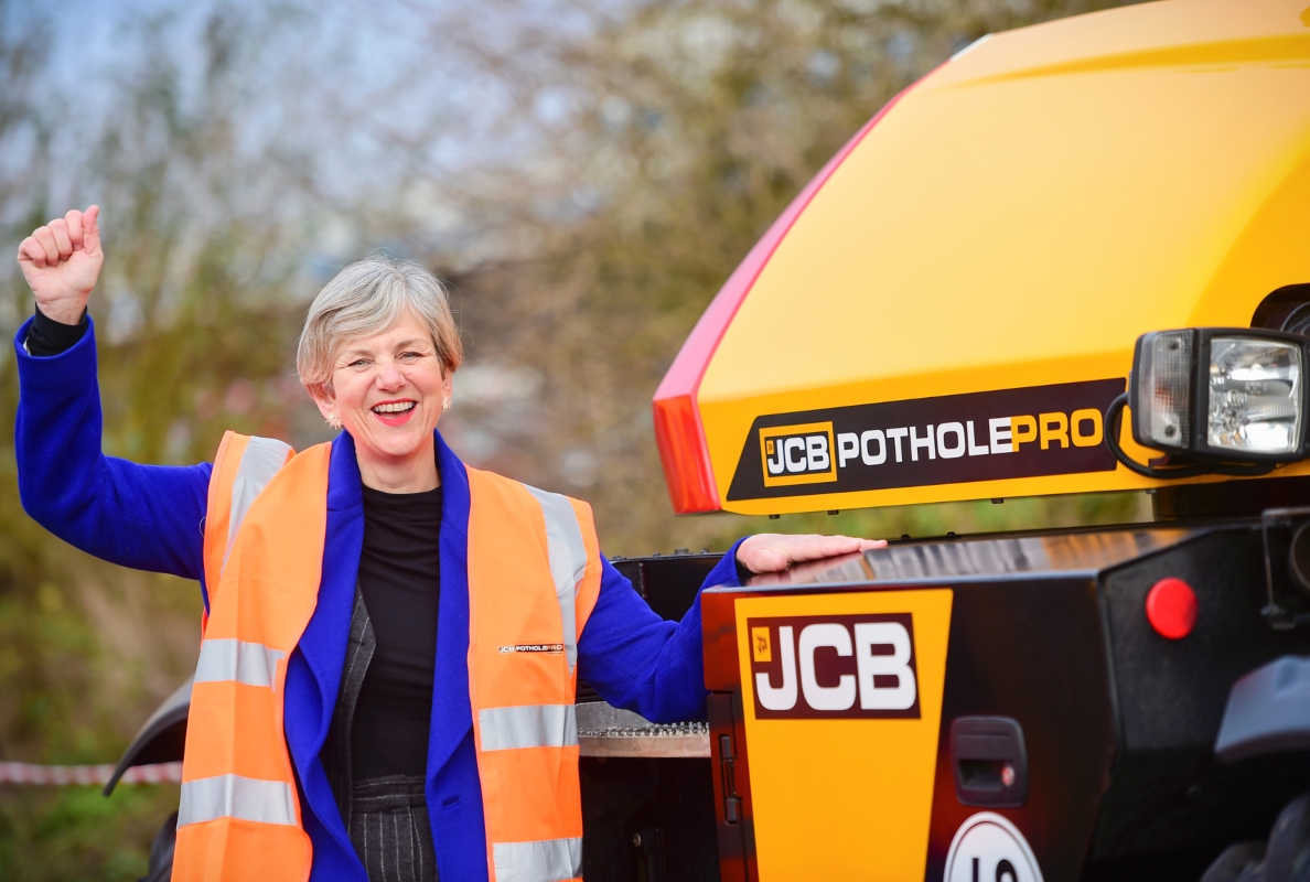 Roads Minister Lilian Greenwood with the JCB Pothole Pro