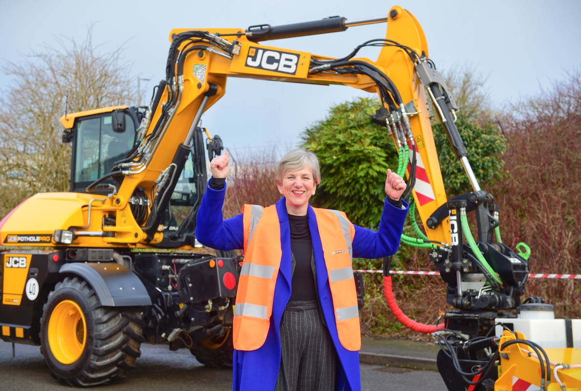 Roads Minister Lilian Greenwood with the JCB Pothole Pro