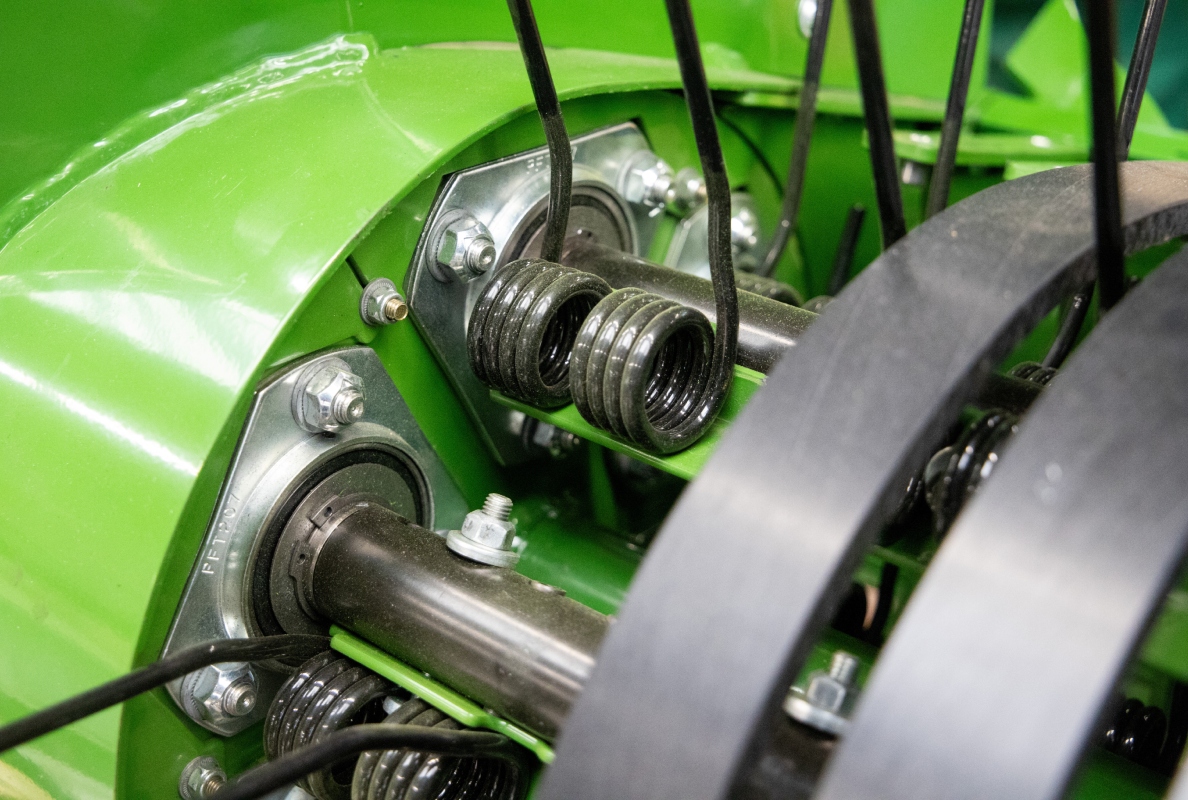 Maintenance-free, three-bearing tine carrier shafts