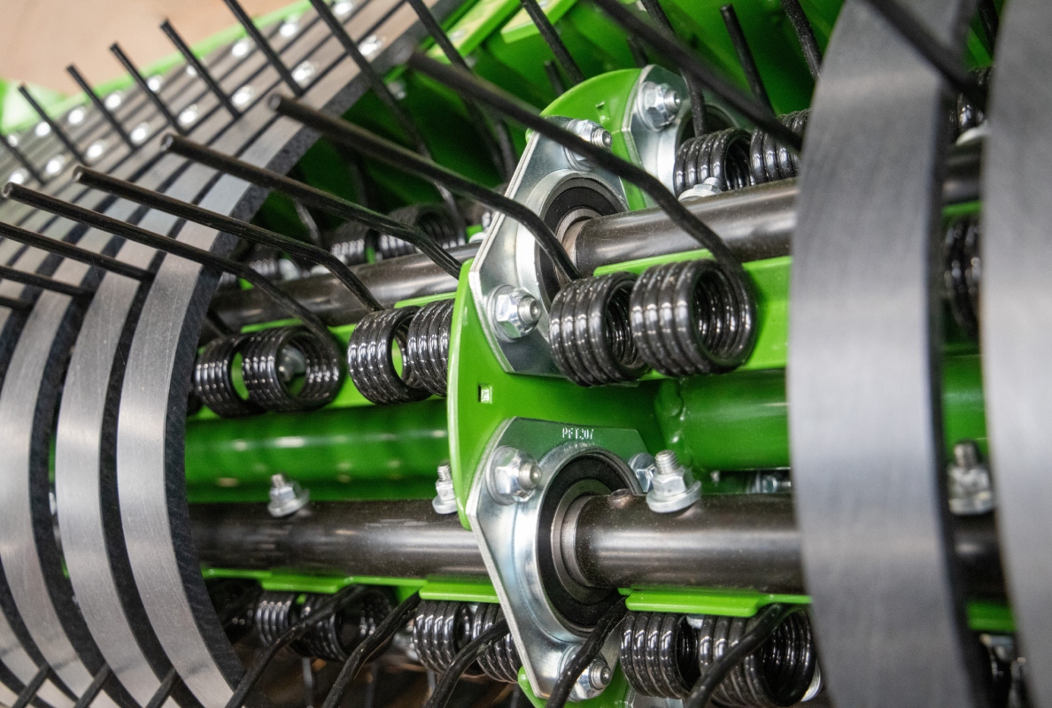 Maintenance-free, three-bearing tine carrier shafts
