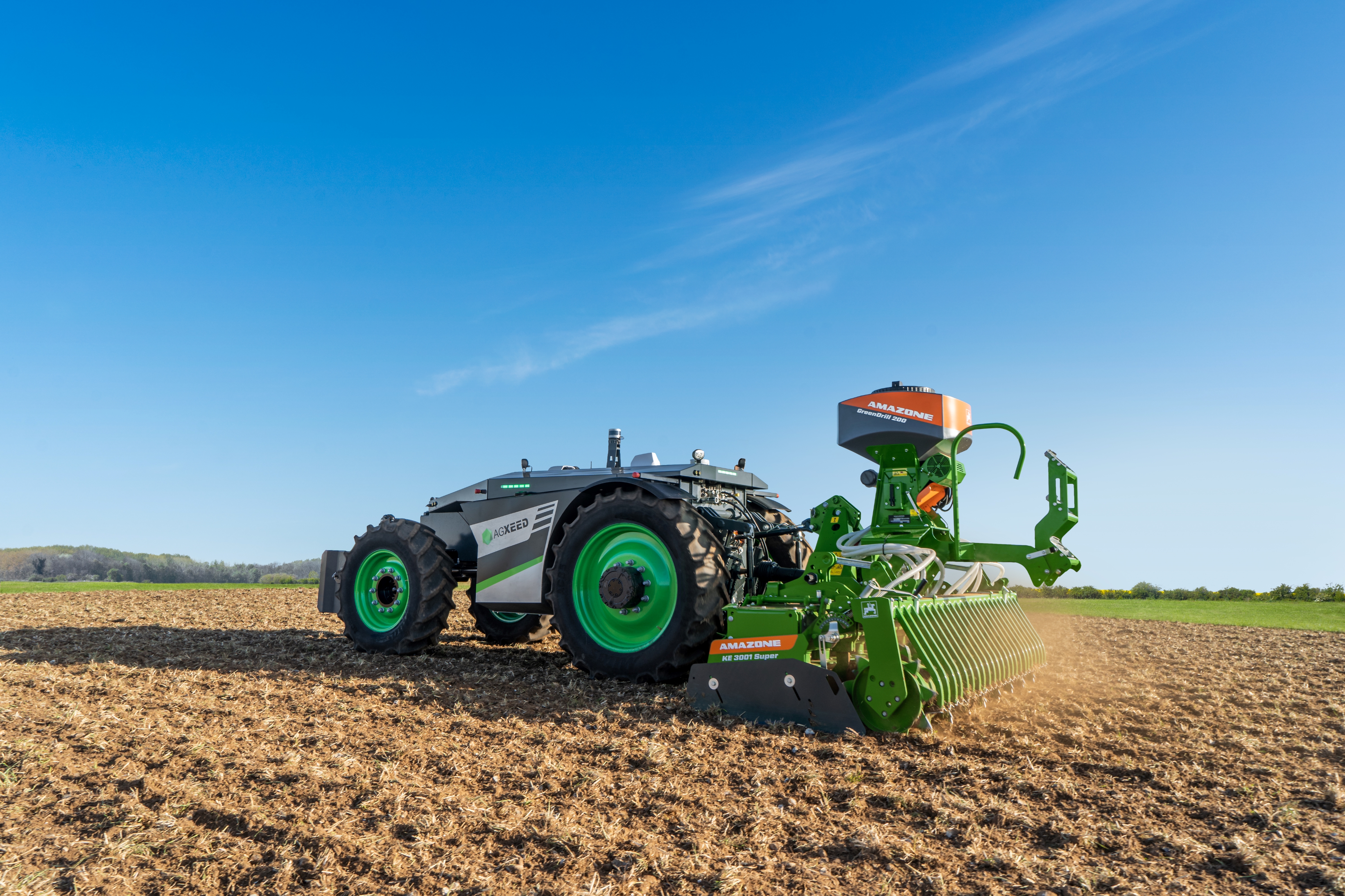 The 4-wheeled AgXeed AgBot and 3 m AMAZONE rotary harrow with GreenDrill catch crop seeder box