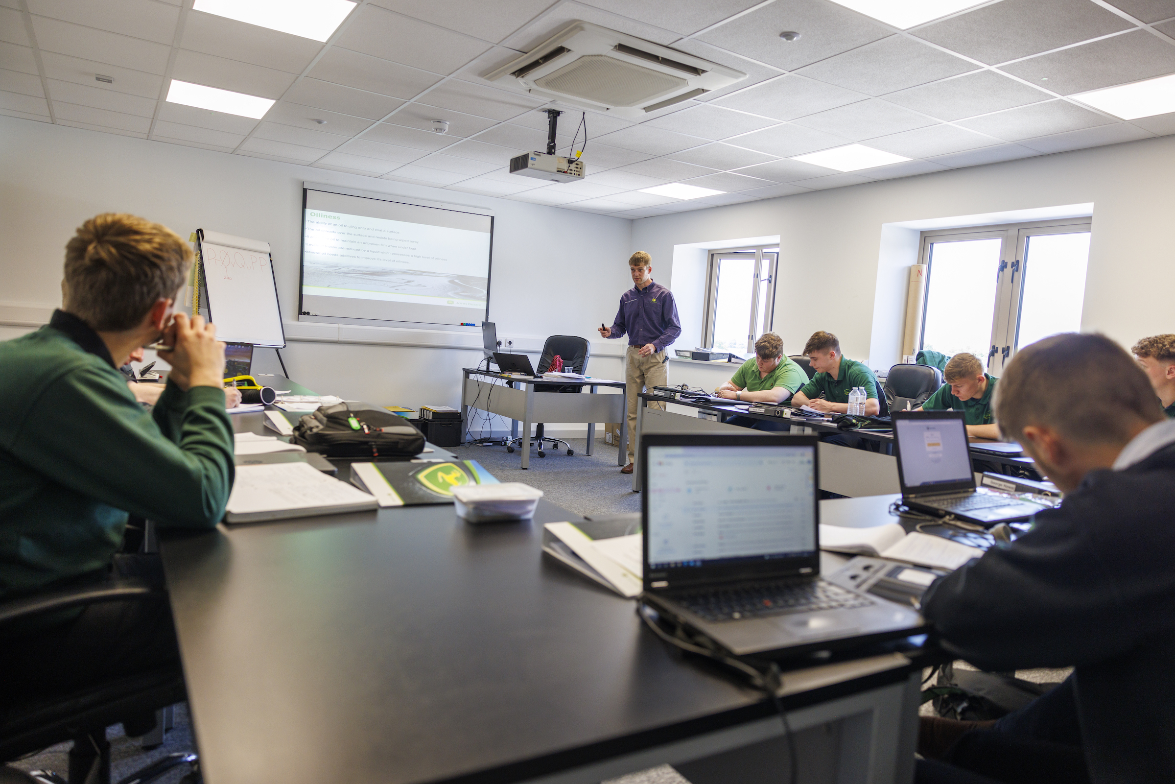 Students study at the John Deere Training Centre when they are not working in a dealership.