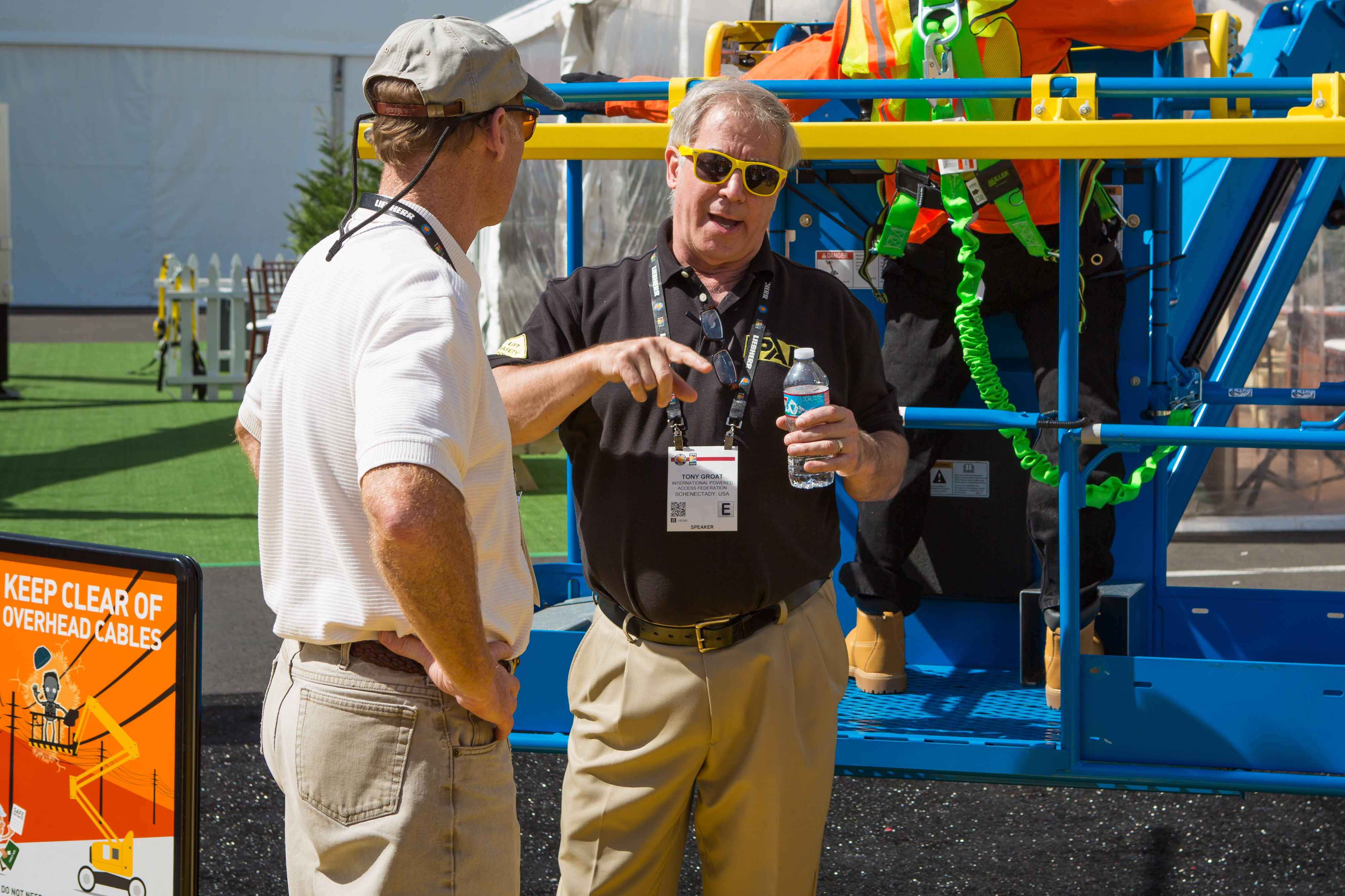 Tony Groat talks to a visitor to CONEXPO