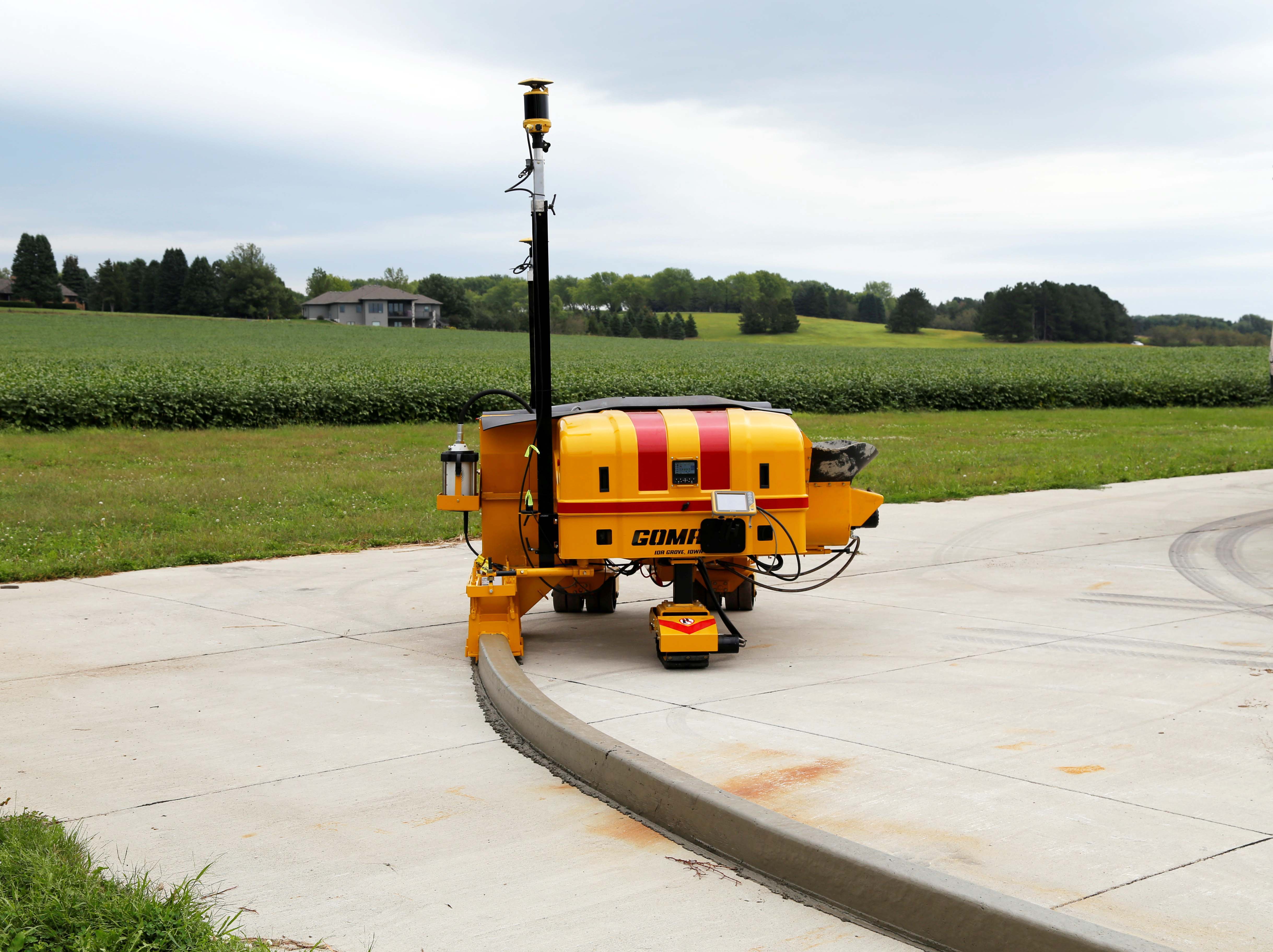 The world’s first battery-powered slipform concrete curb machine, the GOMACO CC-1200e at work.