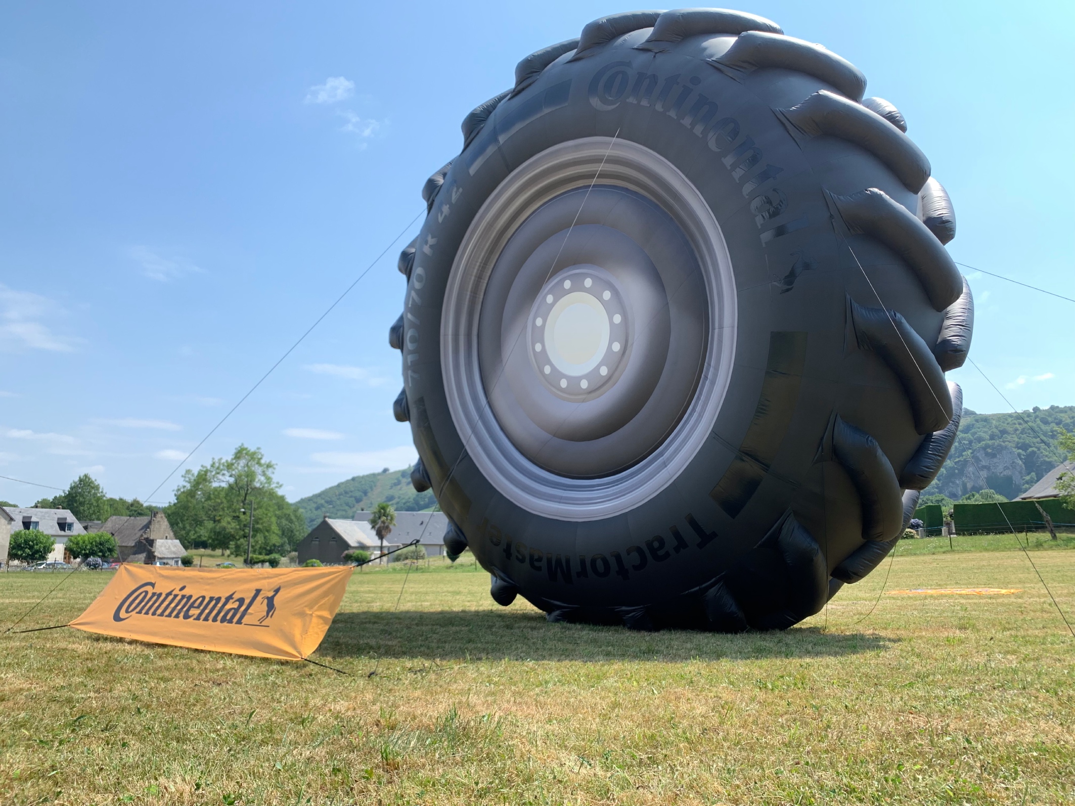 Continental advertises with a giant inflatable TractorMaster tire along the 2022 Tour de France