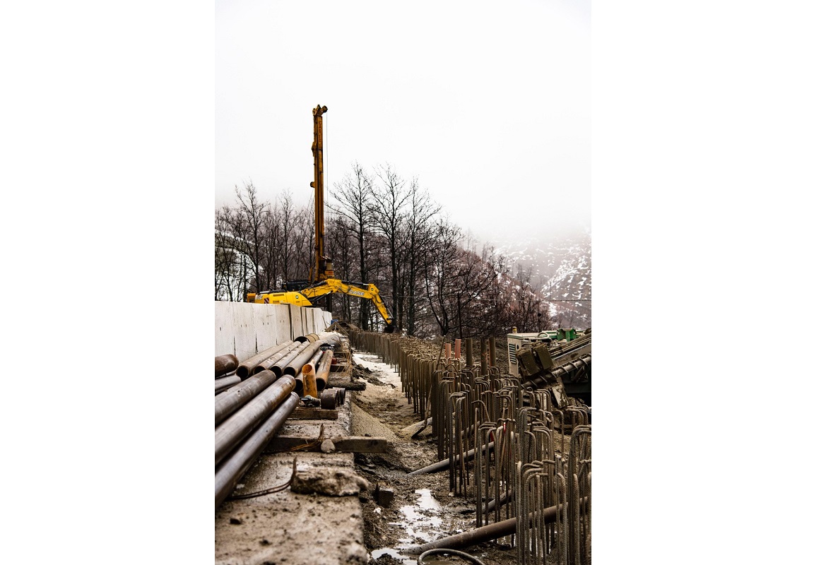 Two CASE excavators work to rebuild and strengthen a site in the aftermath of a landslide at Bocca Trabaria