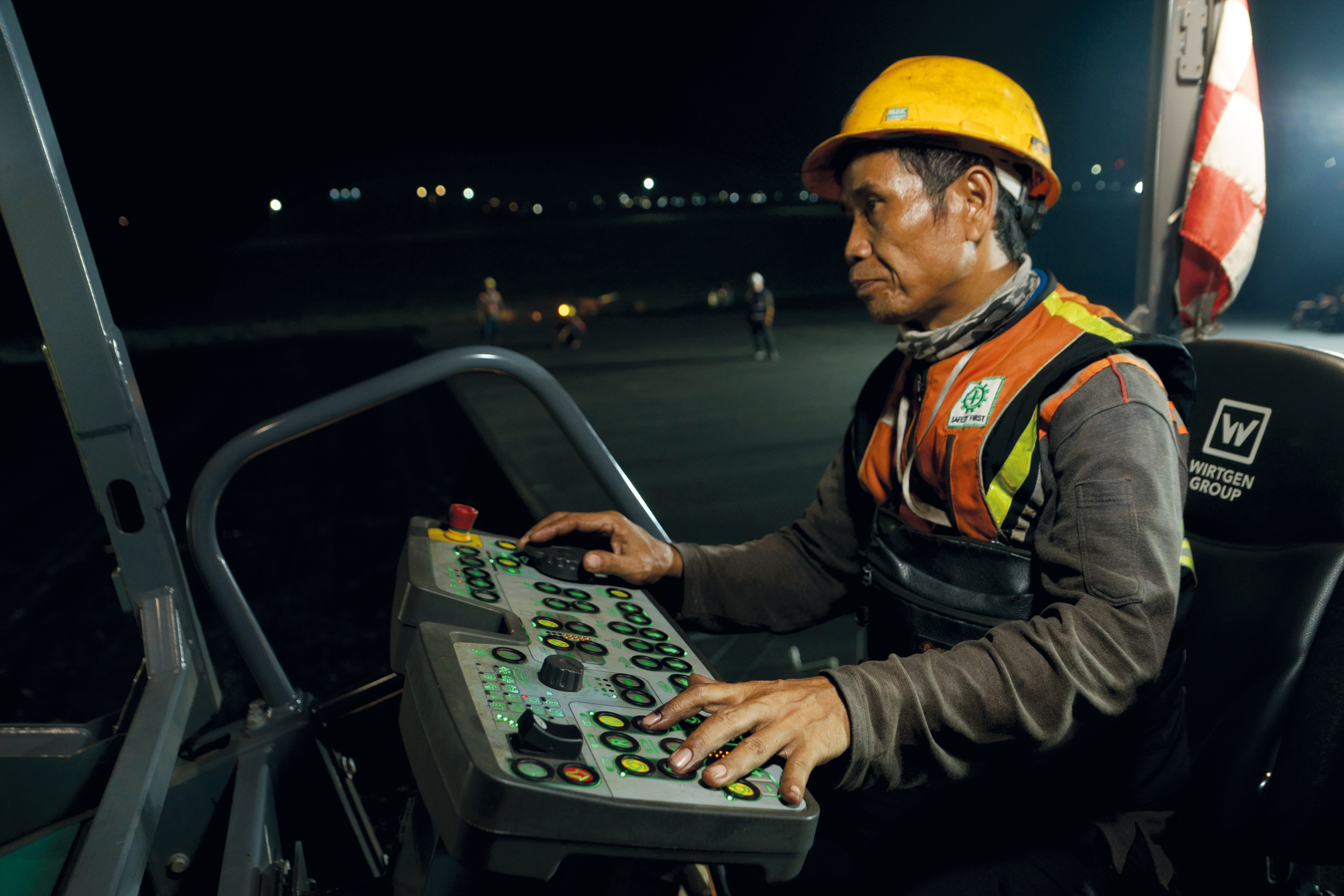 Two pavers work through the night at Indonesia’s largest airport