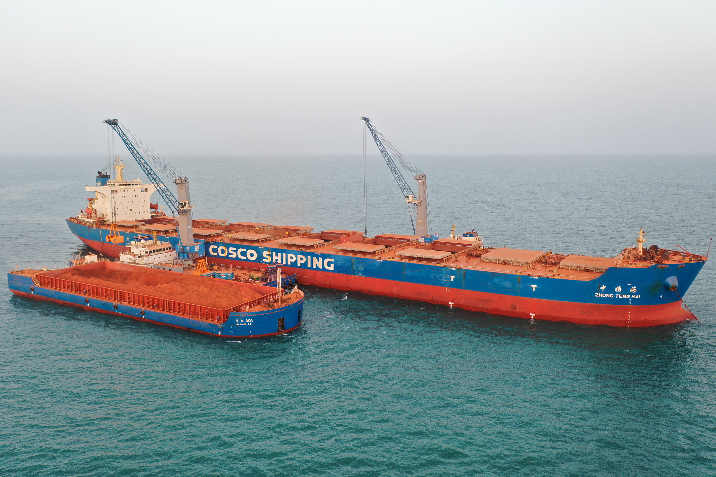 Cosco’s first two Konecranes Gottwald cranes on barge handling bauxite off the west coast of Africa