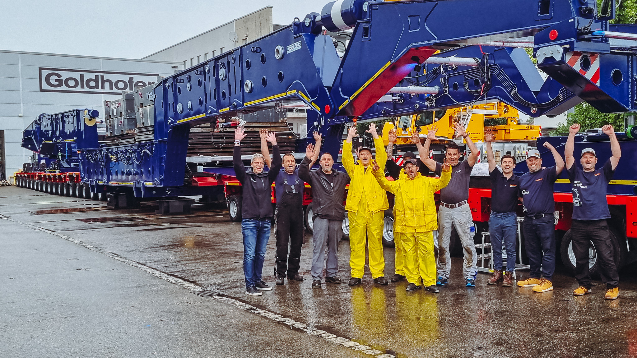 Proud faces: the combined Collett, Goldhofer and Greiner team during overload testing.