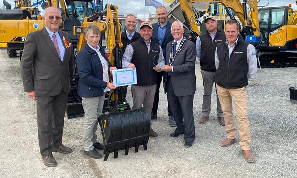 Sleator Plant staff celebrate their award for Best Trade Stand in the Other Equipment & Vehicles category at the 2021 Balmoral Show. <br> Image source: Rokbak