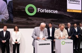 Dr Willi Liebherr of Liebherr and Dr Andrew Forrest of Fortescue officially signing the deal between the two companies.