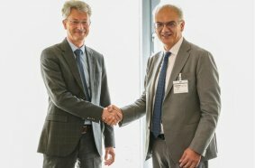 Mr Weiss of Liebherr Mining and Mr Renato Bruno of Bruno Generators Group sign the agreement.