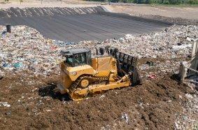 The Cat D8 Waste Handler configuration includes a specialized cab and guarding throughout the machine to take on the demands of landfill work.