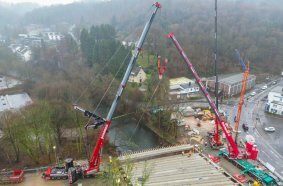 The two 8-axle mobile cranes finish their complex job with girder number eight.