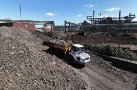 A TA 230 dump truck transports cooled slag from DK and piles it up.