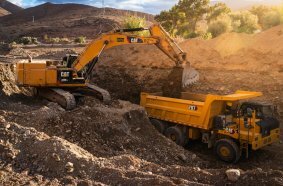 Cat® 707 wide body truck with excavator