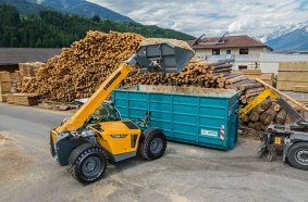 The Liebherr T-36-7s loads wood chips into a container.