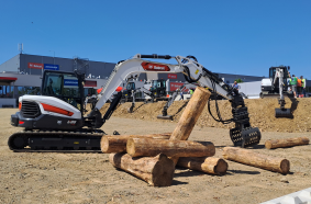 The Bobcat E88 excavator precisely lifts and moves heavy timber