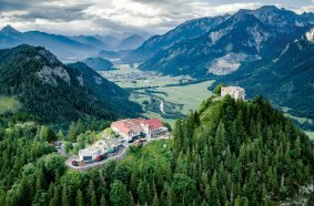 In the Allgäu region, the winding road to Germany's highest castle ruins, Falkenstein, was successfully renovated using three Wirtgen Group machines.