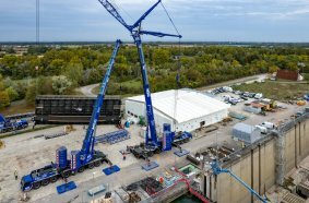 ... barrier gate is first turned by the Liebherr cranes...