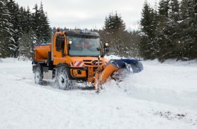 Unimog implement carrier in winter service
