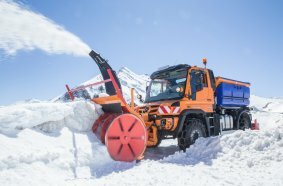 Unimog implement carrier in winter service