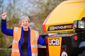 Roads Minister Lilian Greenwood with the JCB Pothole Pro