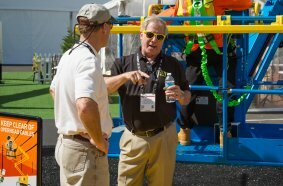 Tony Groat talks to a visitor to CONEXPO