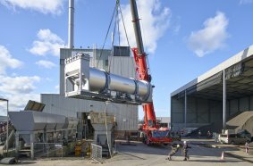 Positioning of the Benninghoven dryer drum in preparation for installation.