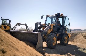 The Volvo Construction Equipment L25 Electric compact wheel loader and ECR25 Electric compact excavator at work for Baltic Sands Inc. in the California desert during the pilot project.
