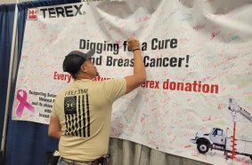 Visitors to the Terex Utilities booth were invited to sign a banner to help raise funds for breast cancer research.