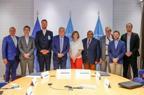 Beth Bechdol, FAO Deputy Director-General, and Carlo Lambro, CEMA Vice President stand for a group photo at the end of the FAO/CEMA Signing ceremony at the FAO headquarters.