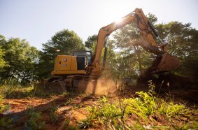 Cat 308 CR Mini Excavator using MHE Ease of Use features during septic installation.