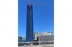 Compass Equipment’s Potain MDT 489 is busy at work on the vertical expansion of the Elara Hotel in Las Vegas. The topless crane has the needed reach and capacity to complete the elevator shaft and four additional stories to the building without impacting local air rights.