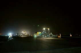 Two pavers work through the night at Indonesia’s largest airport