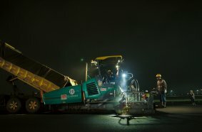 Two pavers work through the night at Indonesia’s largest airport