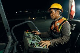 Two pavers work through the night at Indonesia’s largest airport